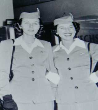 1950s Pan Am stewardess, Rosalie Tropper, and colleague pose for a picture at the airport.